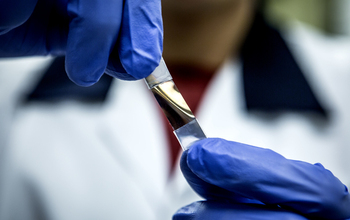 person holding a chiral nanoparticle film